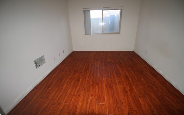 Large Bedroom with hardwood laminate floor