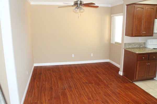 Dining room with hardwood floors overlooking Japanese Garden