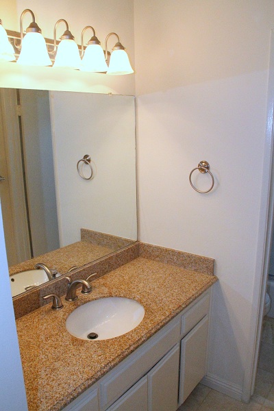 Full Bathroom with Granite Counters 