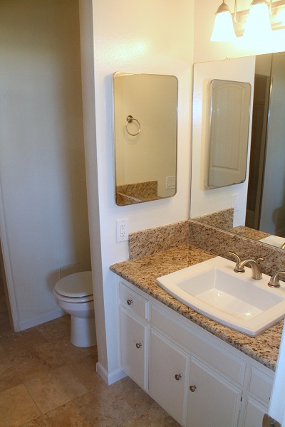 Huge master bathroom with granite counters and marble floor, tub and shower