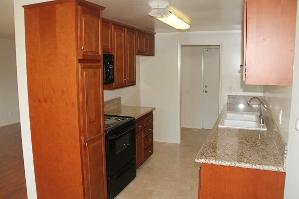 Fully upgraded kitchen with Granite counters, Travertine floor and cherry wood cabinets