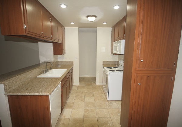 Kitchen with granite counters, Travertine floors and built in appliances