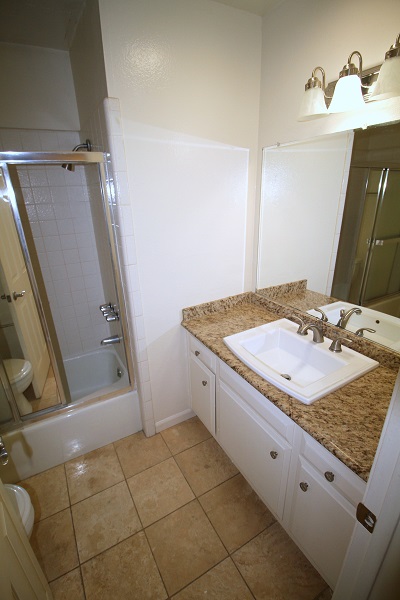 Full upgraded bathroom with Granite Counters and Travertine Floor Full Bathrrom with Granite Counter and Travertine Floor
