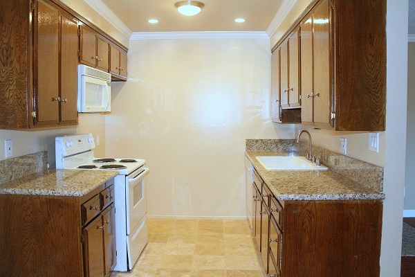 Kitchen with imported granite counters and Marble Tile