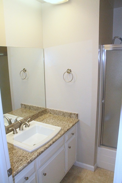 Full Bathroom with Imported Granite Counter and Travertine Marble Floor