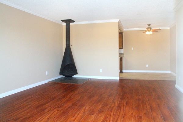 Extra Large Living Room with Hardwood Floor and Wood Burning Fireplace