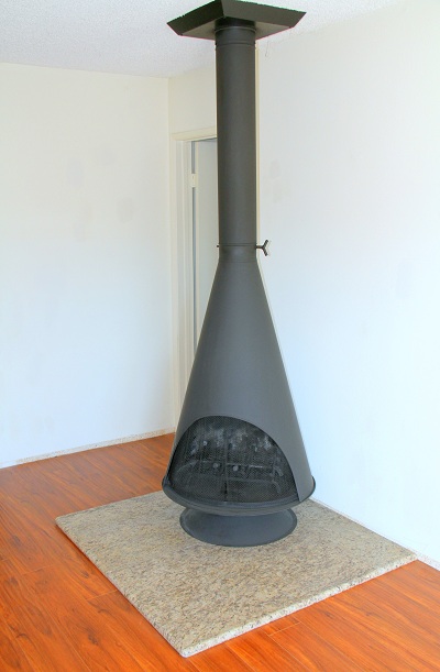 Wood Bruning Fireplace and Imported Granite Hearth in Living Room