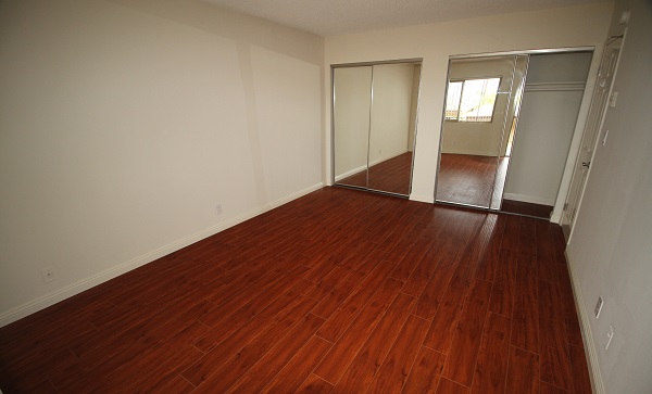 Large Upper Floor Bedroom with hardwood floor and Balcony Access